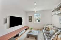 This main level bonus/media room adds to the versatile living space of the home.