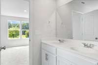 Owner's bathroom with double vanities