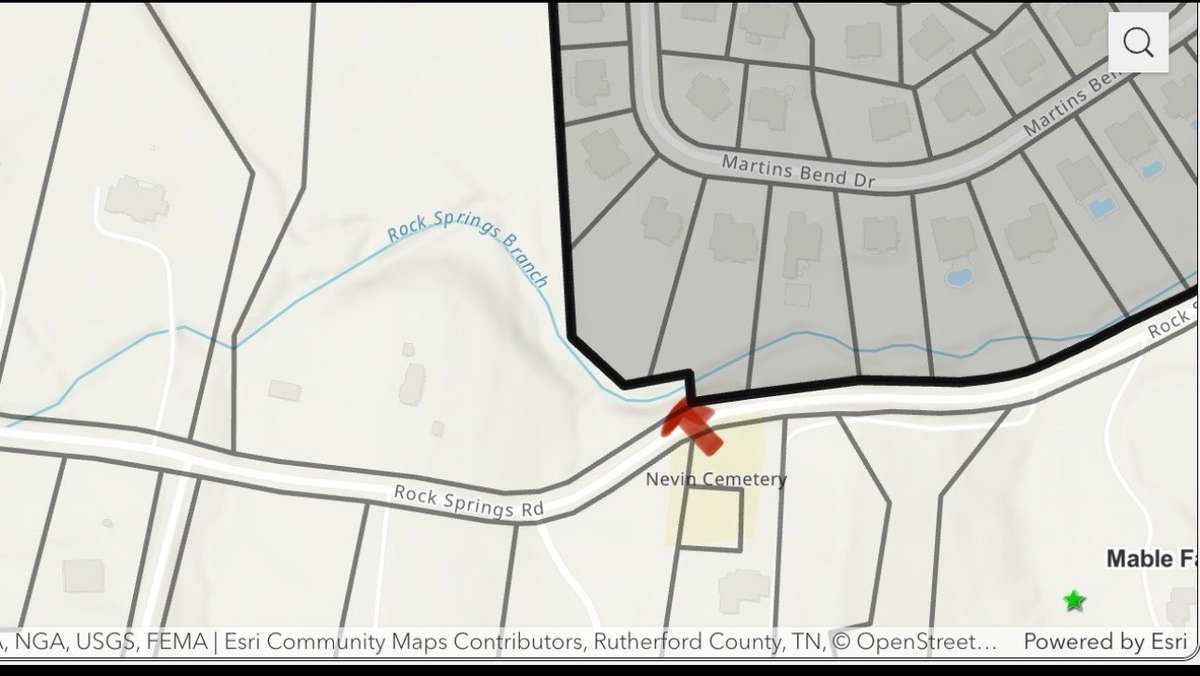 Mable Farms Development is across the street and the area in red is where the sewer tap will be.  Water, Electric and Natural Gas are already on the property.