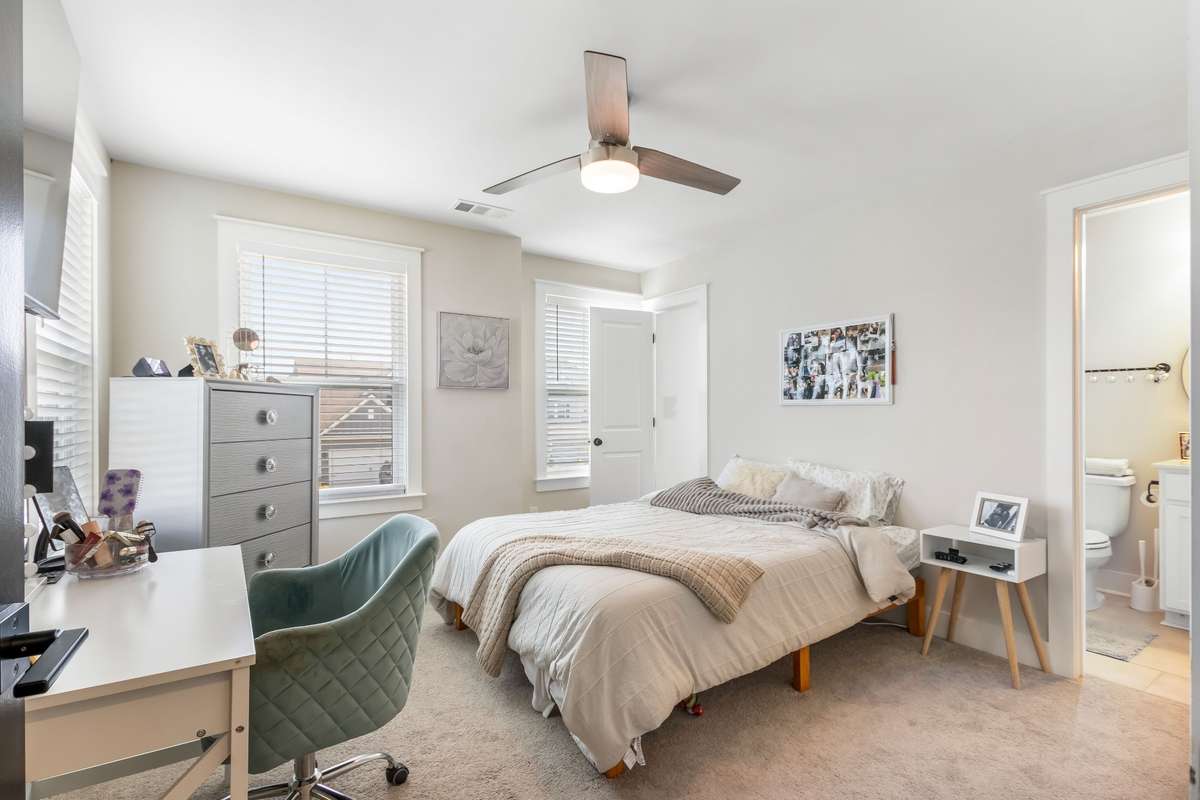 The fourth bedroom offers a private bathroom and a walk in closet as well as triple windows and a beautiful ceiling fan. This room is perfect for a teen suite. It is also the ideal guest suite - your guests will have their very own private space.