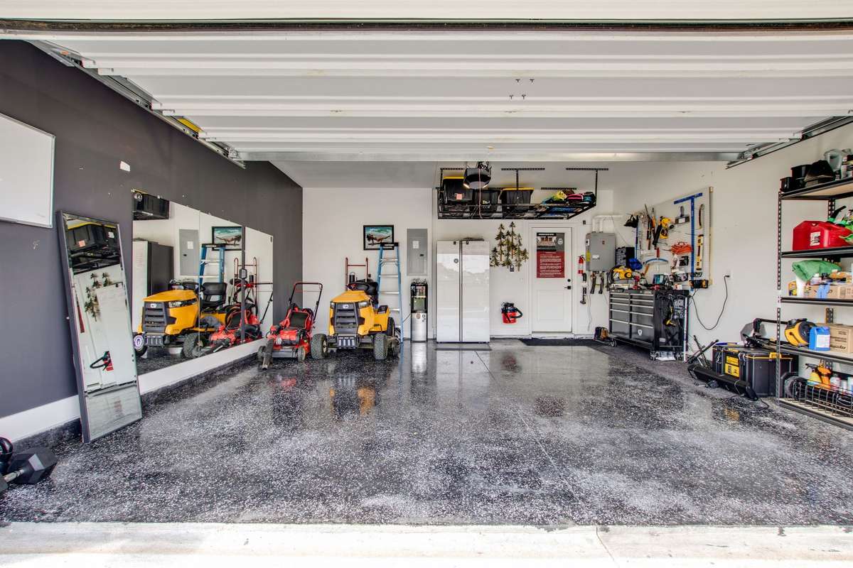 THIS is the garage that you NEED!  Yes that IS a tankless water heater. Instant hot water for your whole home!