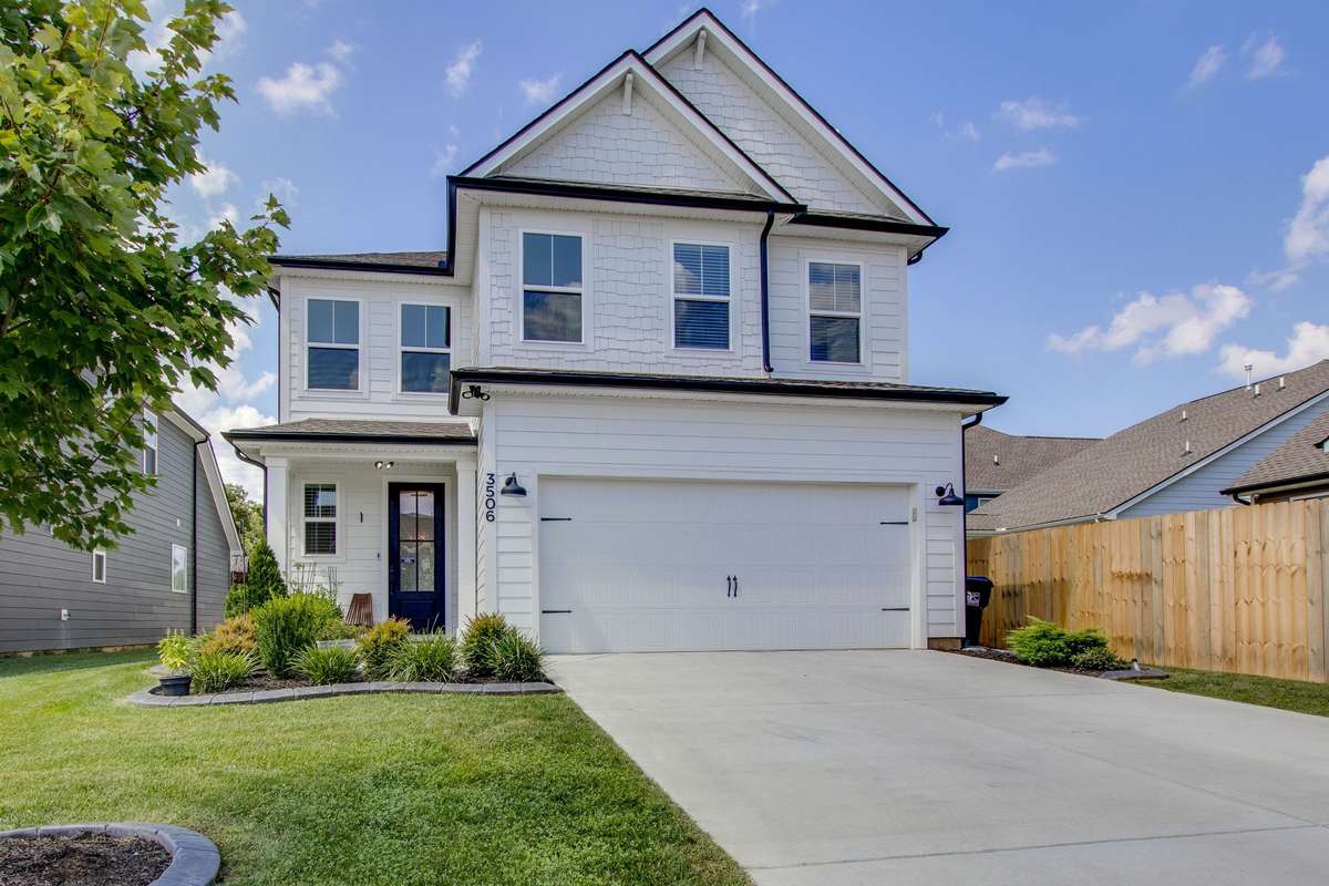 Decorative curbing in the front and back yard... Look at that luscious green lawn against the stunning white home backdrop!