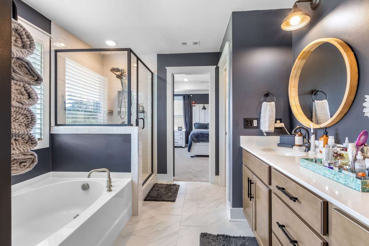 Soaker tub, walk in shower, double vanity, tile flooring... Yes this bathroom has it all!