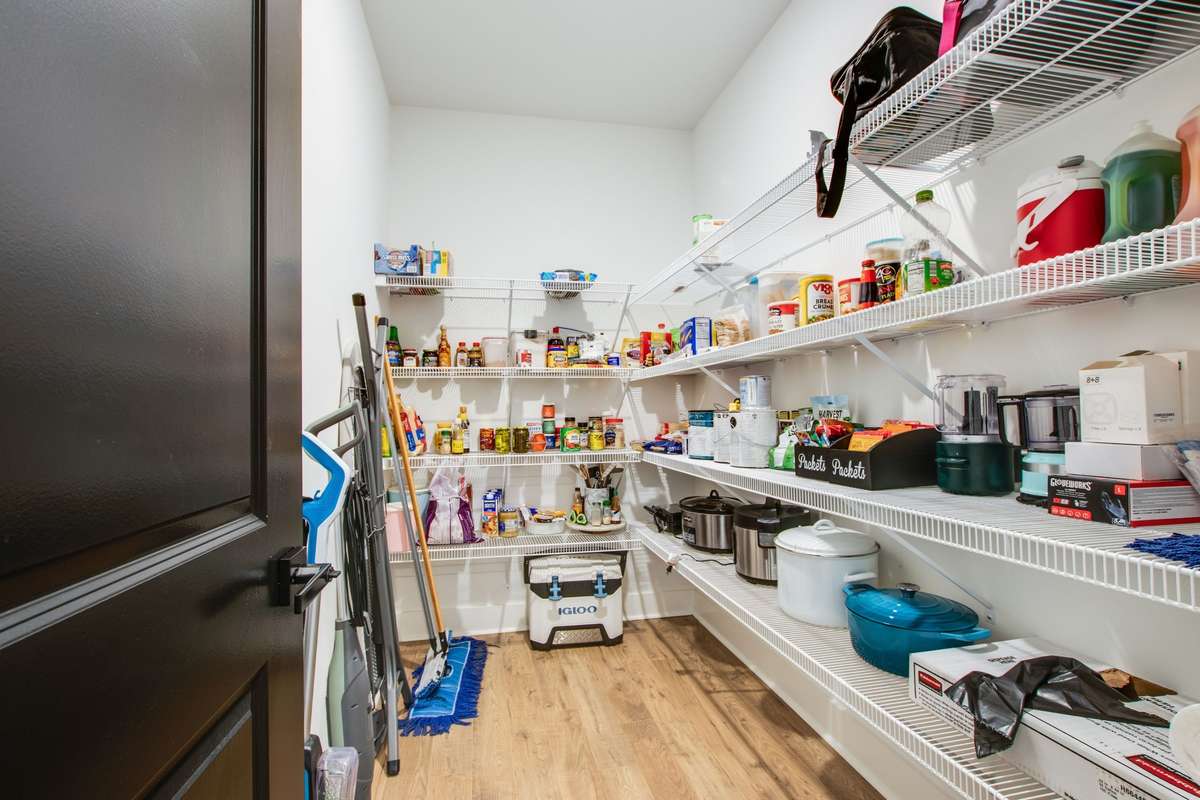 Massive walk in pantry offers plenty of storage for ALL of your accoutrements.