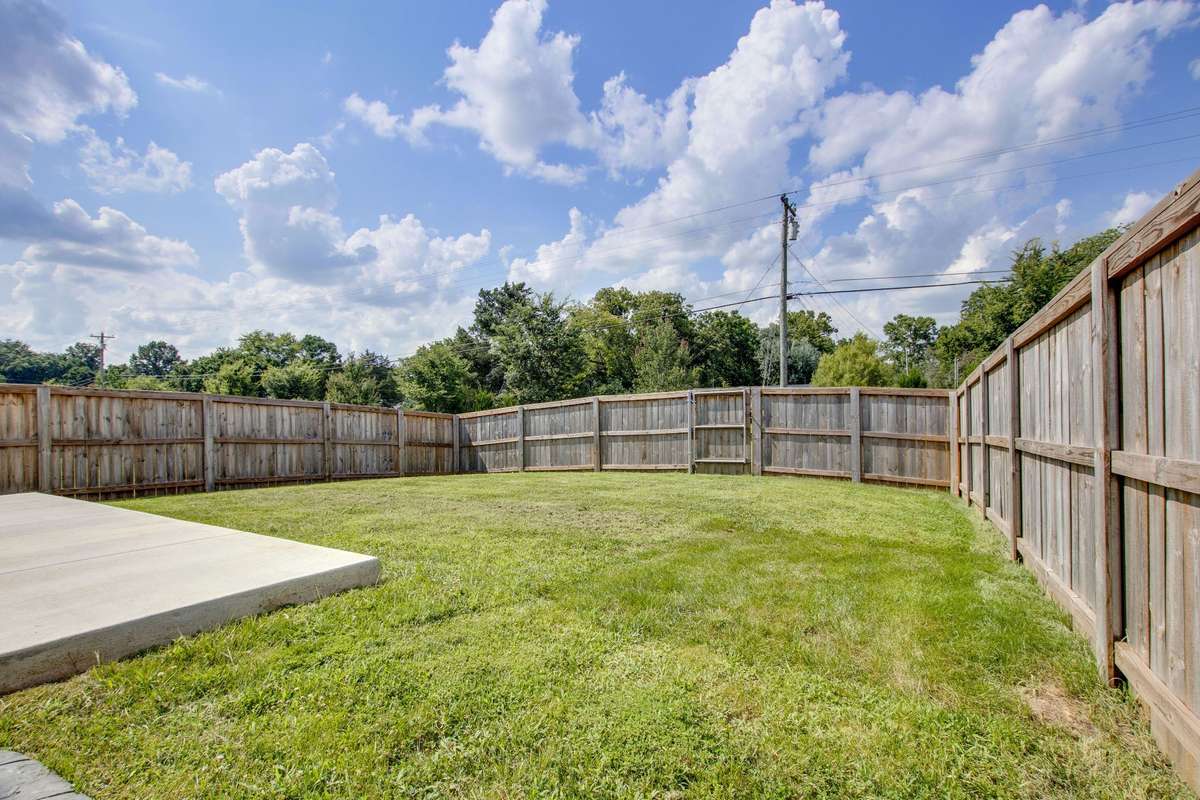 The back yard is fully fenced in and has two gates. There is plenty of room to PLAY!