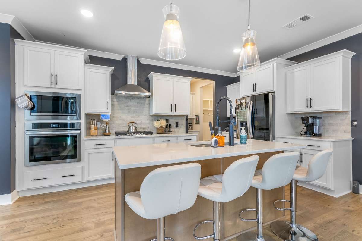 Cascading cabinets and brick tile backsplash offer the look of sophistication that you crave.