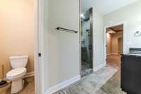 Separate toilet area with door in primary bath