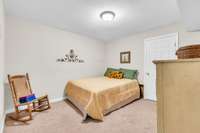 In the basement, the versatile flex room ideal for a home office, studio, or third bedroom option.