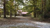 Framed by mature hardwoods and rolling hills, this property, once owned by country music legend Vern Gosdin, captures the essence of country elegance and privacy