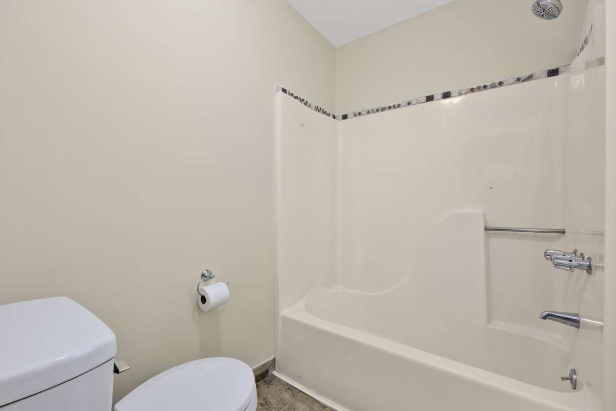 Spacious Full bath upstairs with a simple, practical layout.