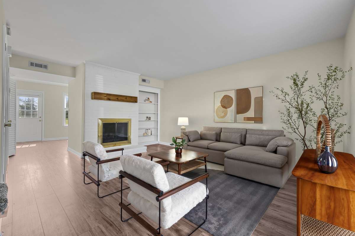Virtually staged living room shows the comfort and layout of the main living space.