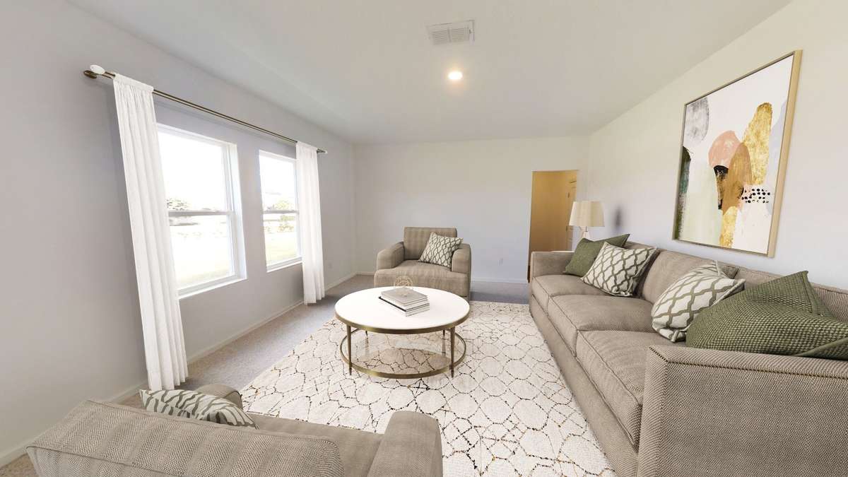 Living room leading to half bath and garage