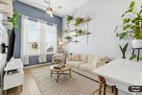 The sellers have already moved their sectional couch out so this photo is virtually staged