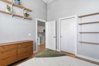 View from the bedroom. The door on the left goes out the the living room and kitchen. The door on the right is a pocket door leading into the walk in closet