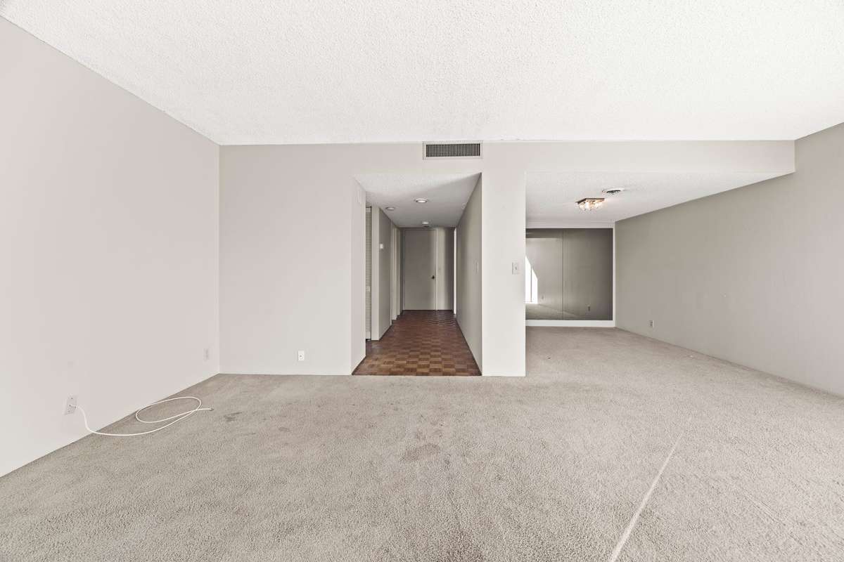 Front Door showing you the Entry to the Half Bath and Laundry then Dining Room to the Right.