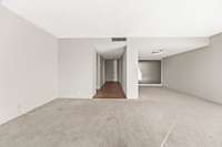 Front Door showing you the Entry to the Half Bath and Laundry then Dining Room to the Right.