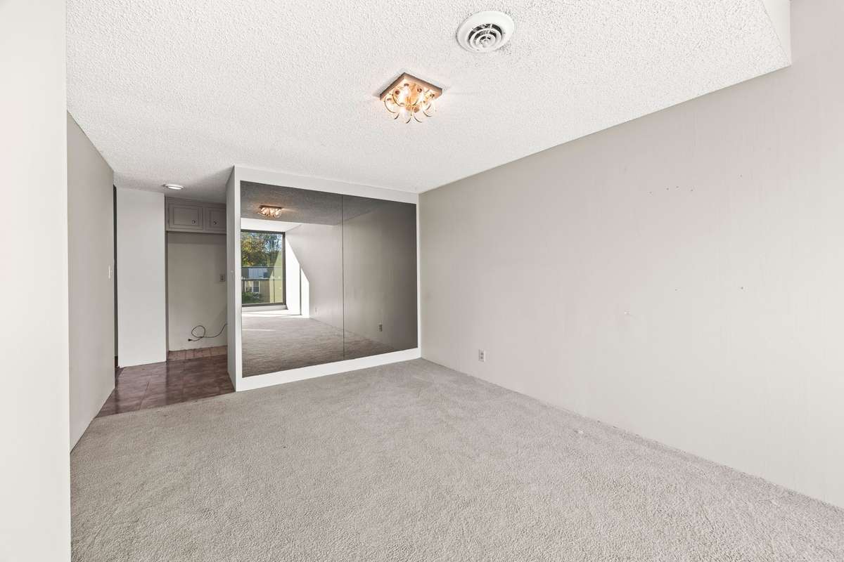 This wall with mirror could be taken down to put an Island in the Kitchen looking out to the Large Dining Room!