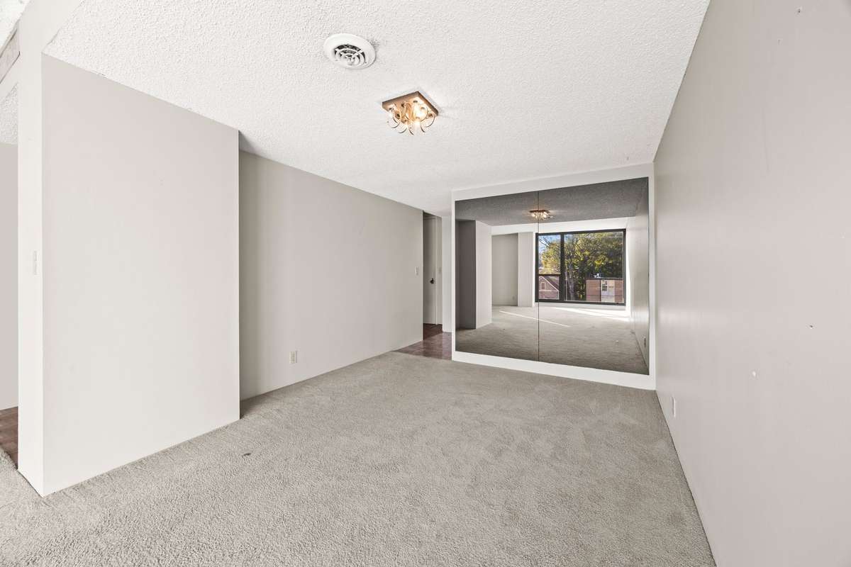 Dining Room with Mirrow on the Wall of Kitchen!