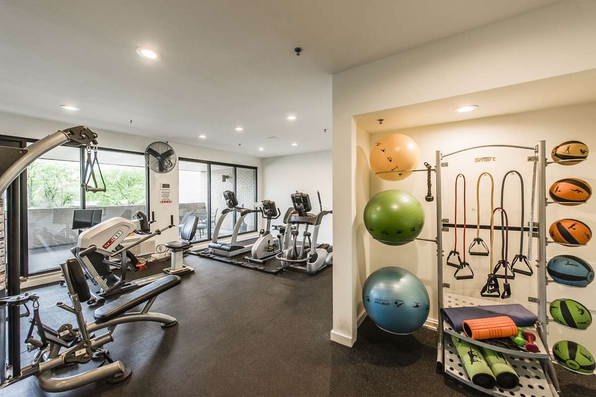 Equipped Workout Room with Full Bath with Cable TV and Balcony that looks over the Pool Area!