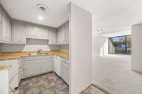 Kitchen looking into the Dining Room then Living Room.  Bring All Offers!