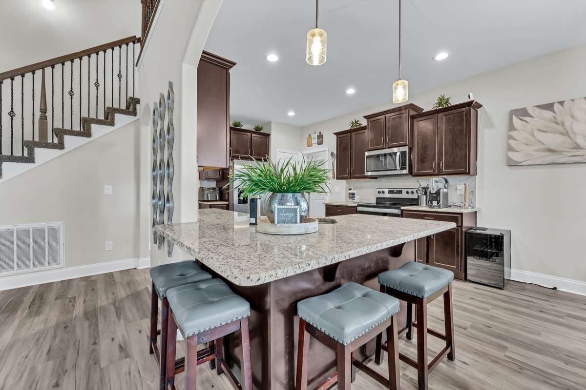 Spacious kitchen with granite counter tops and breakfast bar