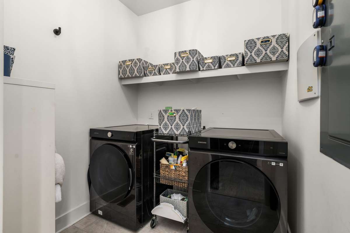 *SLIDING BARN DOORS LEAD INTO THE WALK-IN LAUNDRY ROOM*