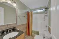 Second bathroom has granite countertop.