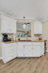 Kitchen with opening to living room makes the cook feel included.