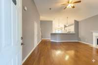 Open entertaining and living space to kitchen is comfortable and well designed (Some photos have been adjusted for staging purposes.)