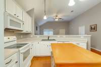 Kitchen has a fantastic work triangle, while also being open to family and friends (Some photos have been adjusted for staging purposes.)