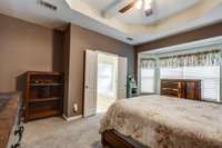 Primary bedroom is newly carpeted. En suite bathroom with separate tub and shower, walk in closet, and double vanity. There is abundant space for everyone. (Some photos have been adjusted for staging purposes.)