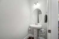 Entry powder room with pedestal sink
