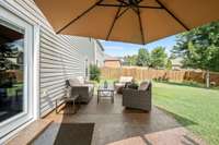 Patio with fenced in back yard