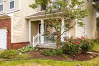 Gorgeous and cared for landscaping adorn the front of the home