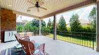 Can you imagine spending time on your covered porch?  Hot tub does not convey.