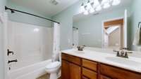2nd floor bath with shower / tub combo and double sinks.