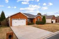 Enjoy the huge concrete driveway and spacious two-car garage, perfect for parking and storage. Your dream home awaits!