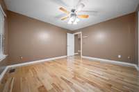 Comfortable primary retreat boasting gorgeous, updated floors.