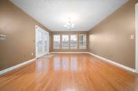 Open dining area featuring plenty of windows and a picturesque view of the backyard