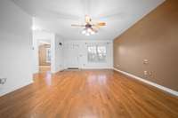 Spacious great room featuring beautiful hardwood flooring