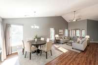 Digitally Staged Combination Living Room/Dining Room.