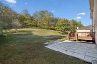 Nice patio off the deck. Look at that back yard