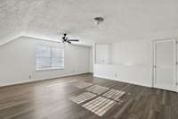 The Bonus Room has LVP flooring, closet and ceiling fan