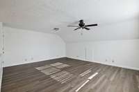 The Bonus Room is just off the Kitchen and very nice size with storage closet.