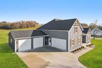 Four garage spaces and a breezeway to the backyard for easy access