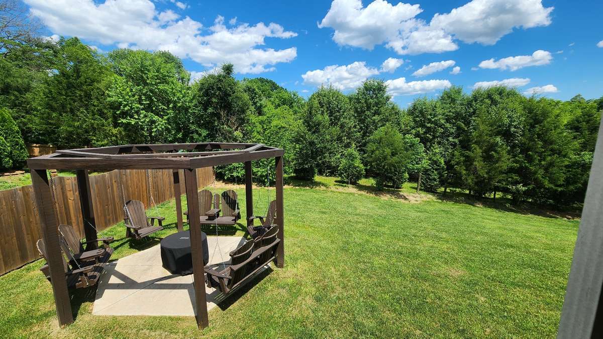 Enjoy your evening fires while swinging on the custom built outdoor entertainment area!