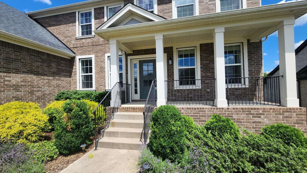 Covered porch to sit and enjoy your quiet neighborhood and watch the kids play pickup basketball.