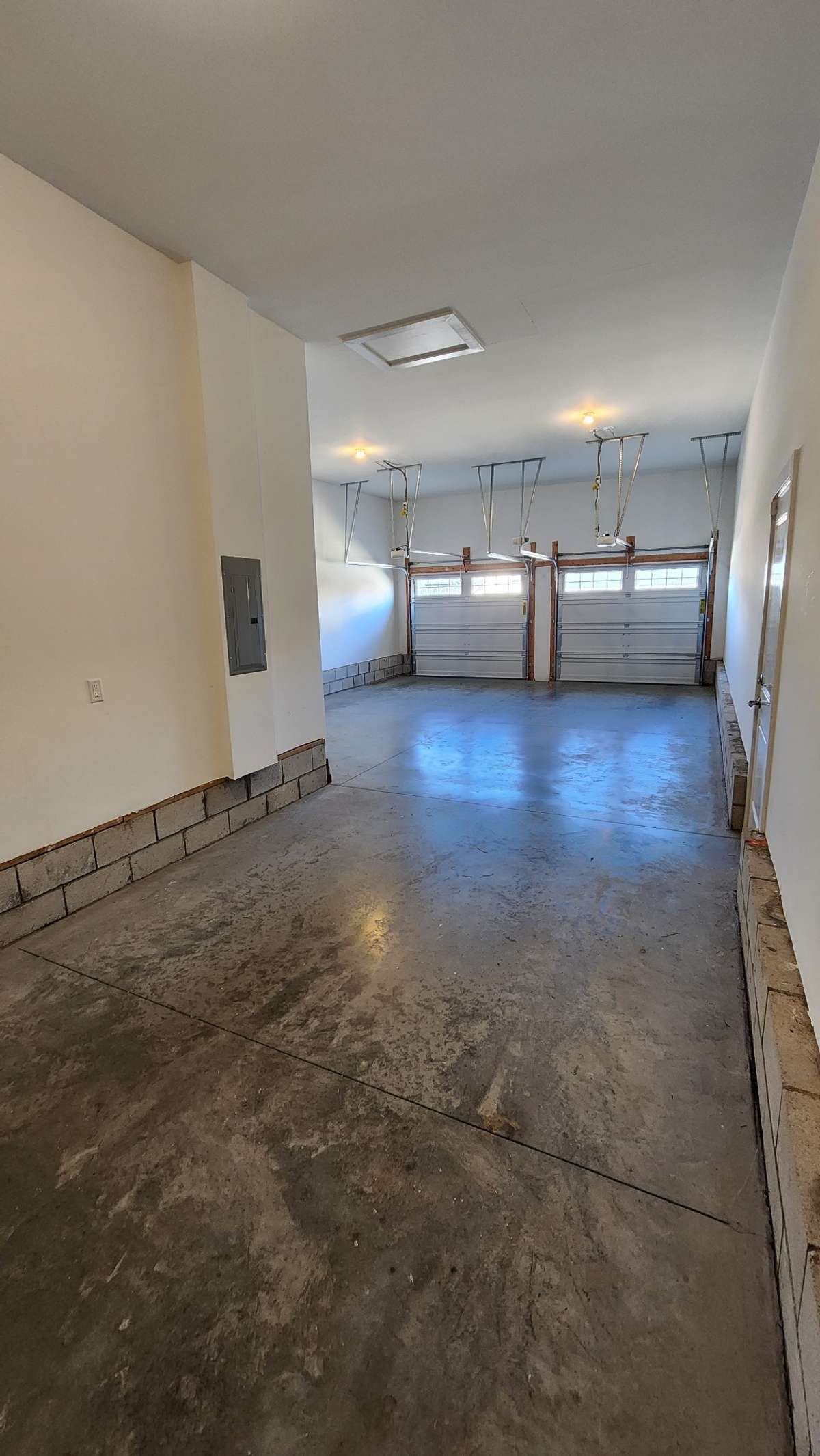 Upgraded oversized triple "tandem" garage with plenty of room for storage and work area...don't overlook the upgraded very handy garage pedestrian door also!