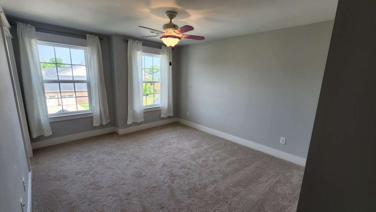 Bedrooms with large windows, plush carpets, and walk in closets!