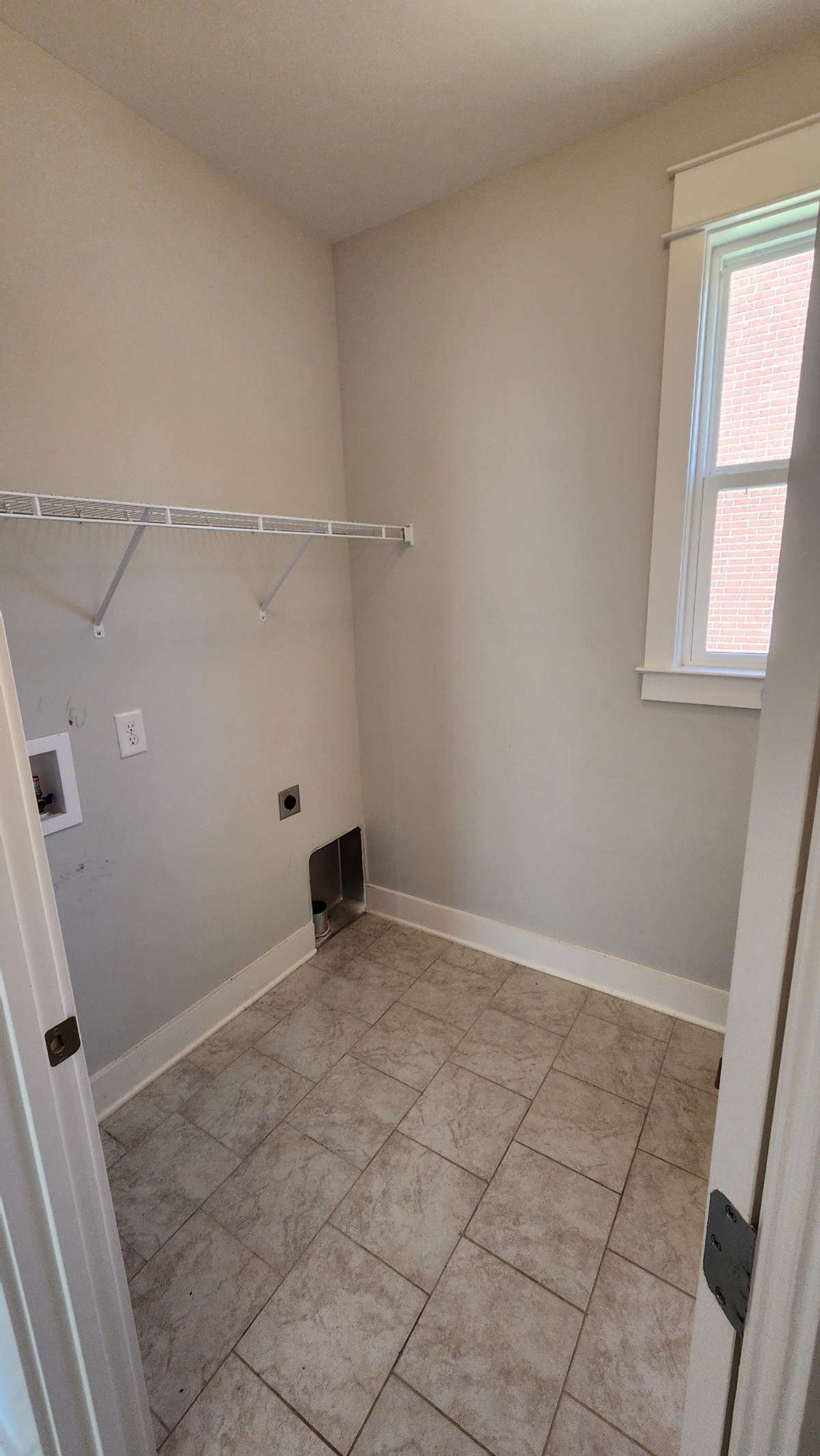 Very hand located laundry room off kitchen with upgraded deep washing sink!
